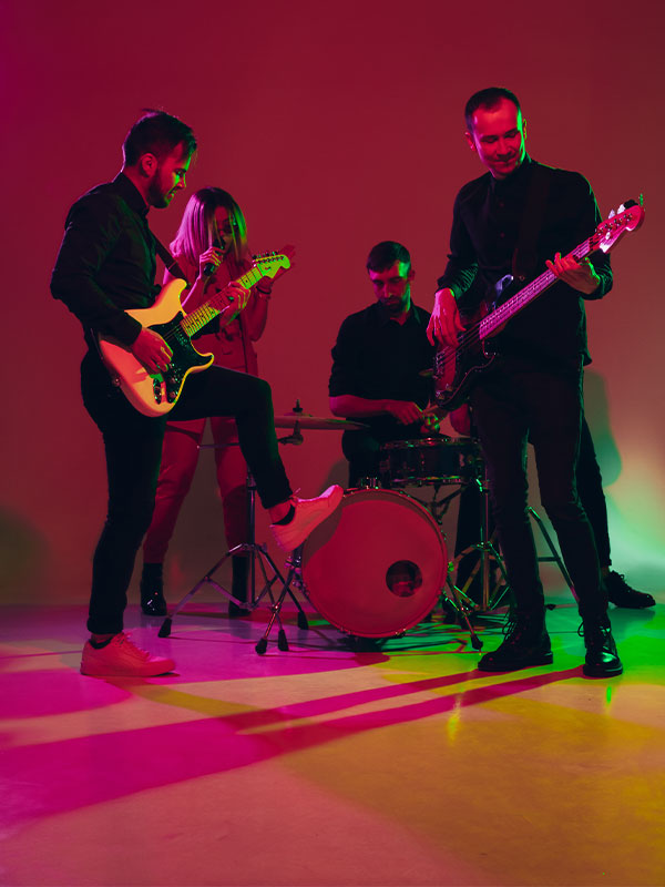 young-caucasian-musicians-band-performing-in-neon-1.jpg